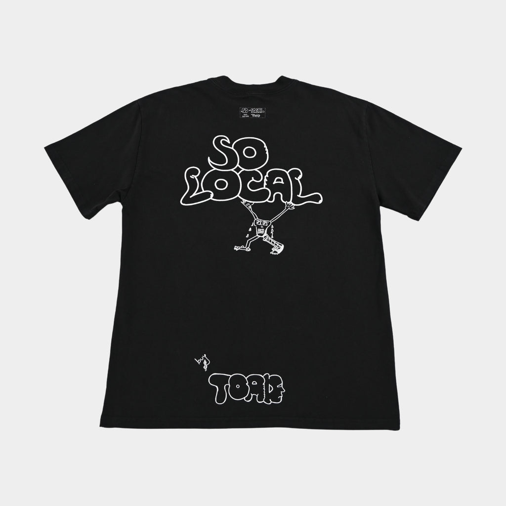 Back flatlay of SO LOCAL heavy faded t-shirt in black, surf and skate streetwear, Gold Coast Australia  