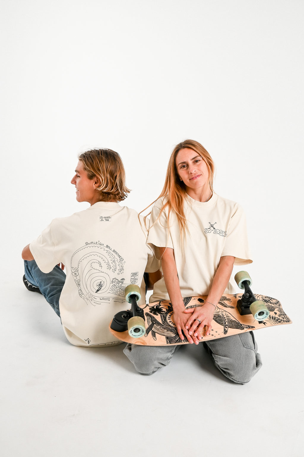 Male and female models wearing BURLEIGH BALL BREAKERS heavy faded t-shirt in butter, surf and skate streetwear, studio shot, Gold Coast Australia 