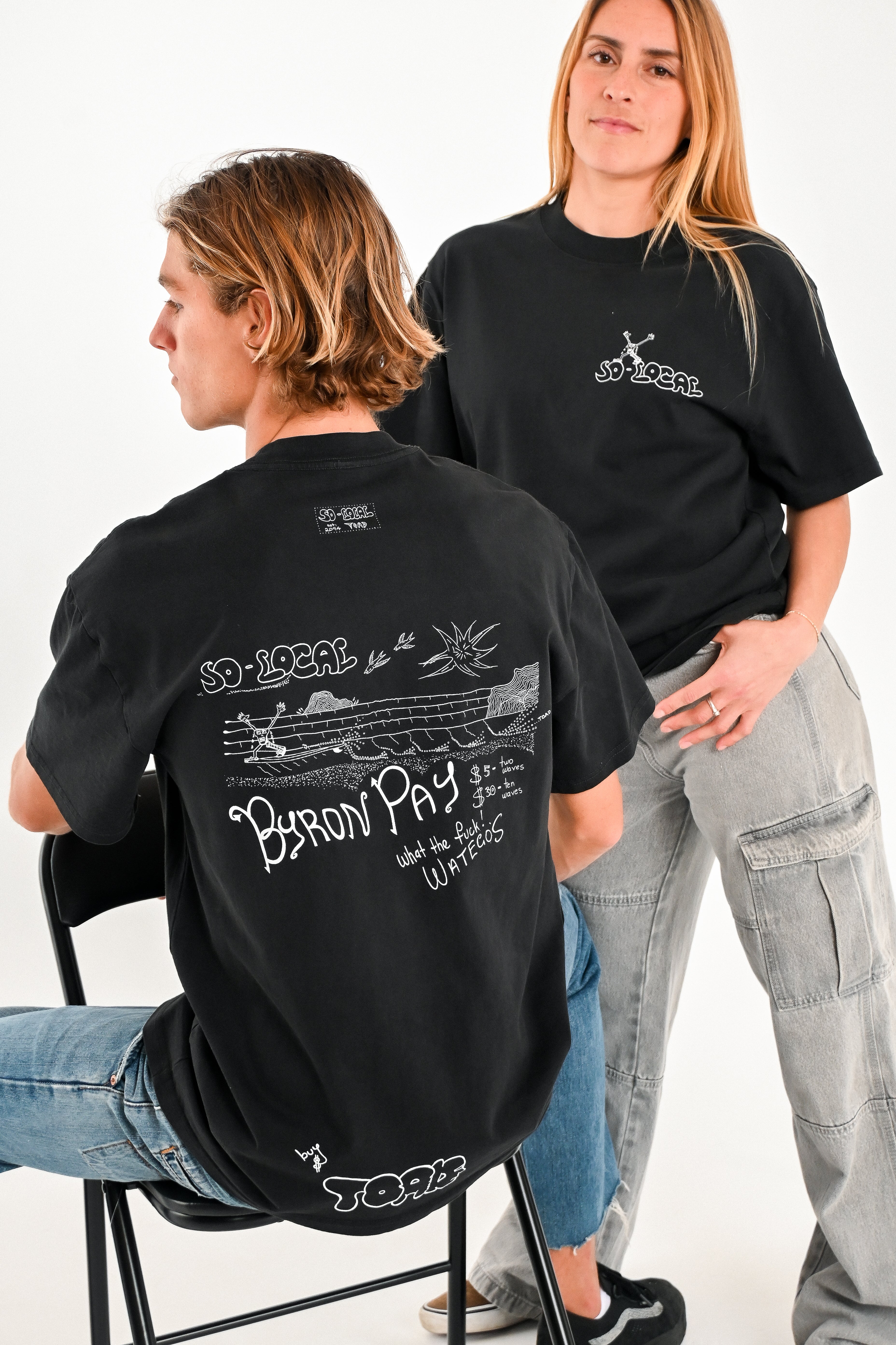 Male and female models wearing BYRON PAY heavy faded t-shirt in black, surf and skate streetwear, studio shot, Gold Coast Australia 