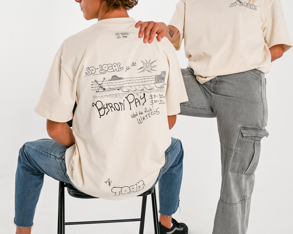 Male and female models wearing BYRON PAY heavy faded t-shirt in butter, surf and skate streetwear, studio shot, Gold Coast Australia 