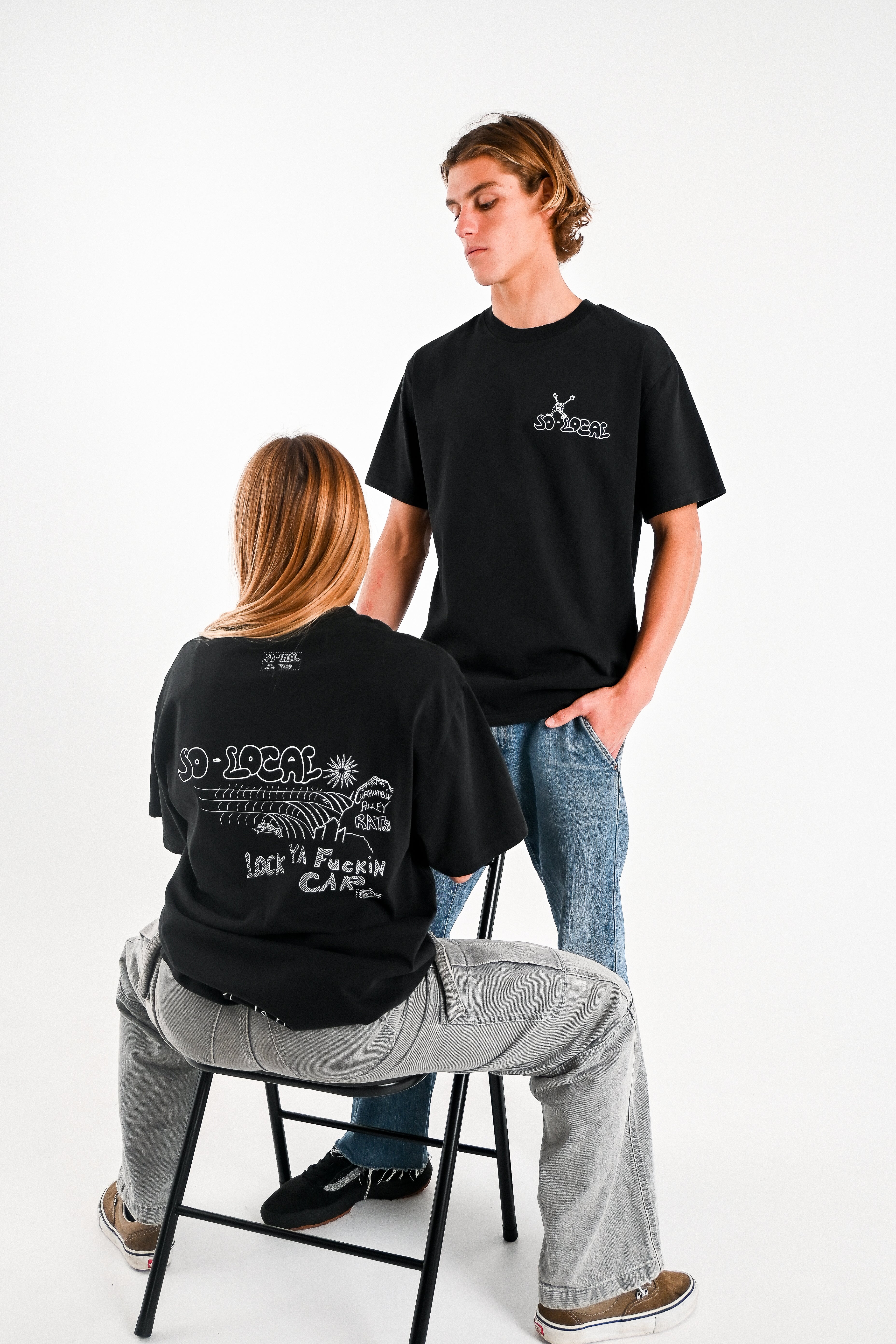 Male and female models wearing CURRUMBIN ALLEY RATS heavy faded t-shirt in butter, surf and skate streetwear, studio shot, Gold Coast Australia 