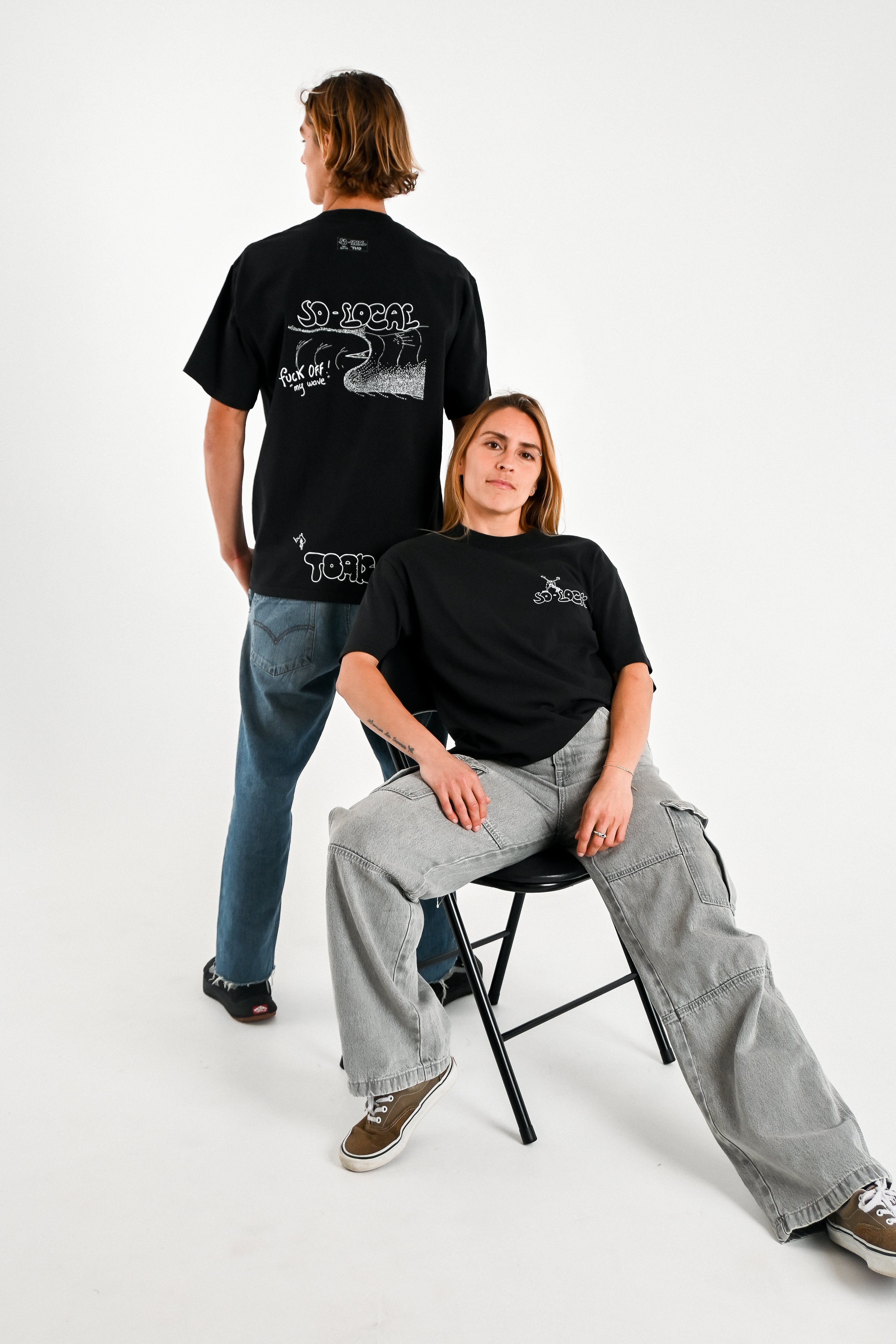 Male and female models wearing F*CK OFF MY WAVE heavy faded t-shirt in black, surf and skate streetwear, studio shot, Gold Coast Australia 