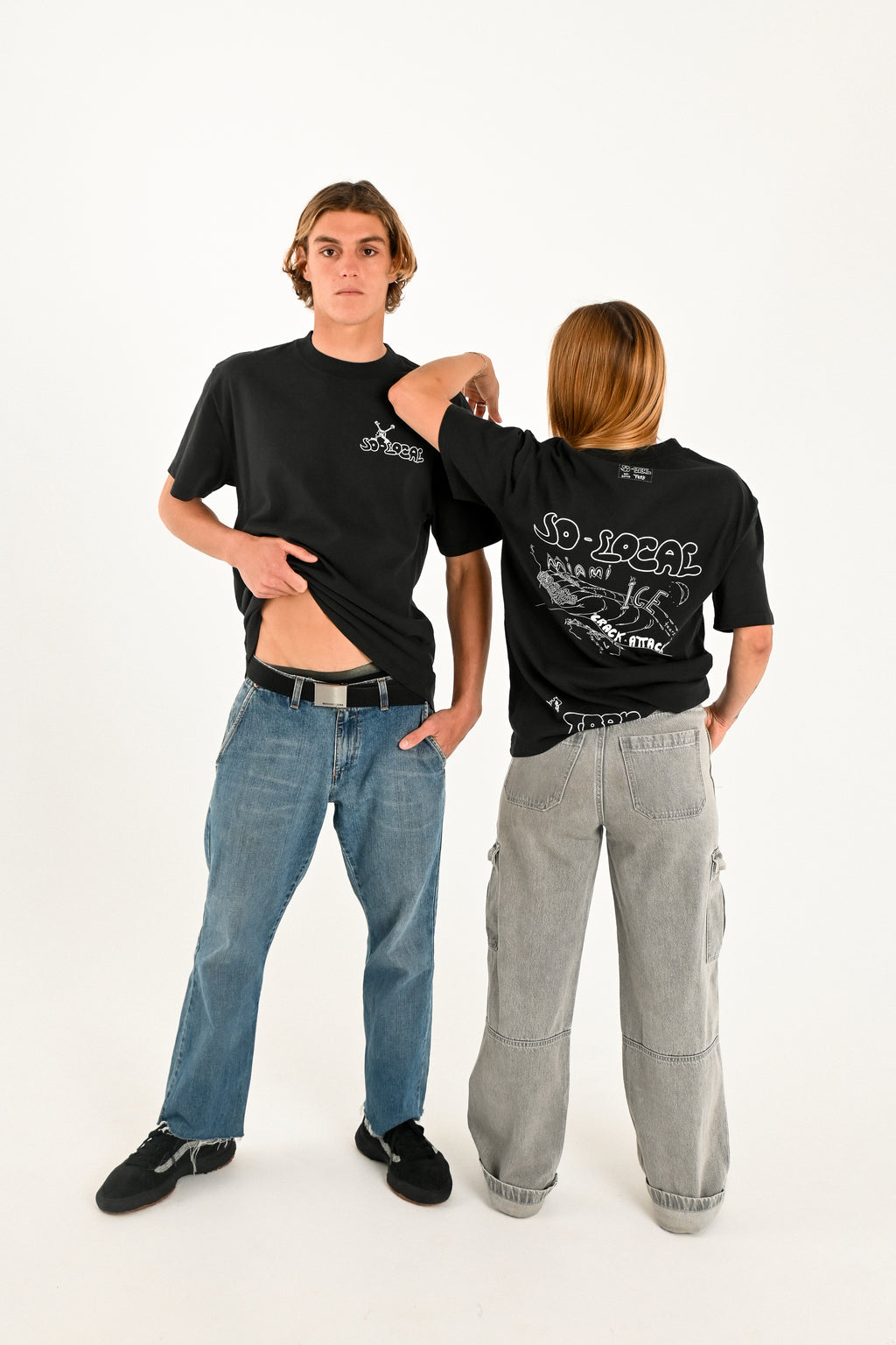 Male and female models wearing MIAMI ICE heavy faded t-shirt in black, surf and skate streetwear, studio shot, Gold Coast Australia 