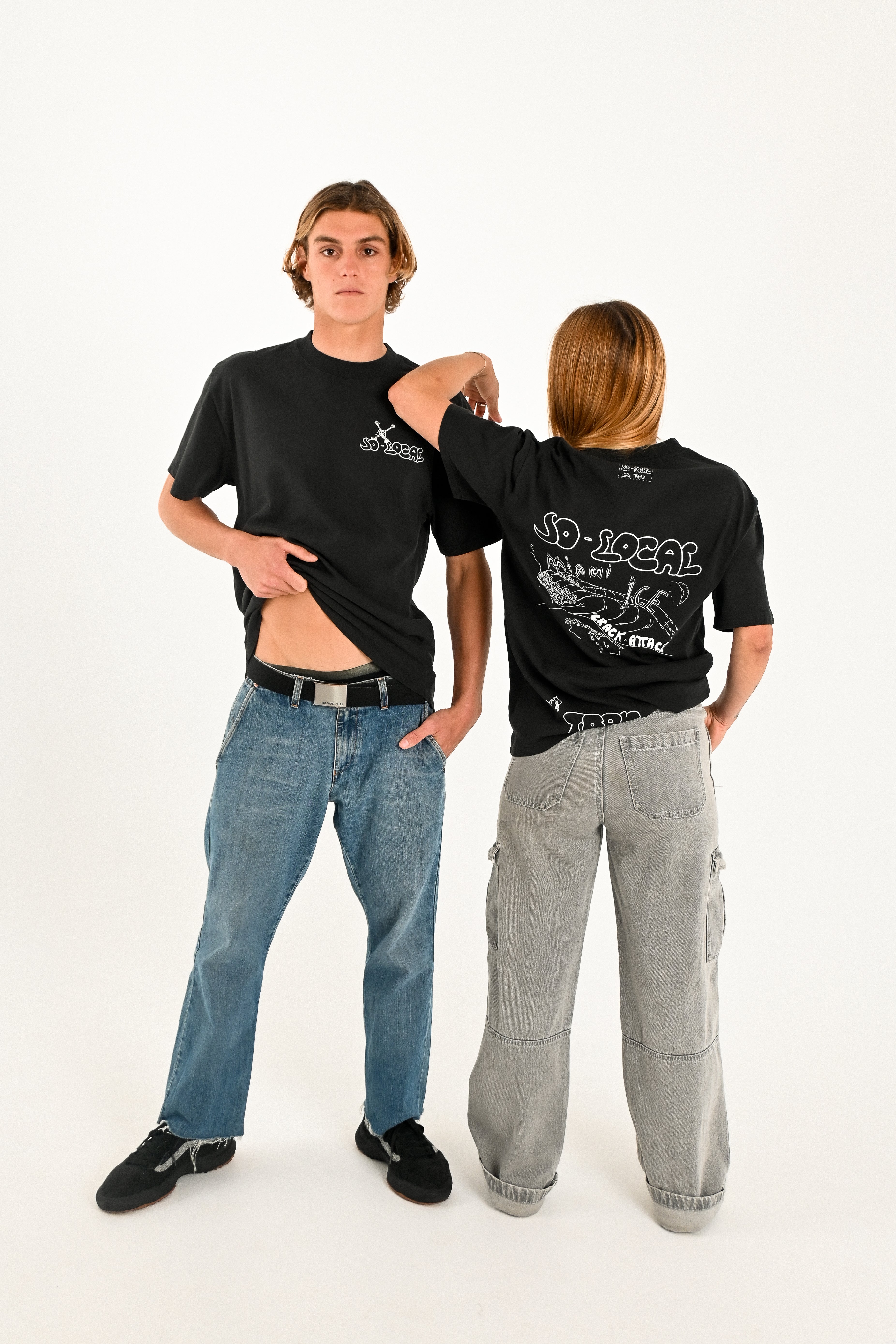 Male and female models wearing MIAMI ICE heavy faded t-shirt in black, surf and skate streetwear, studio shot, Gold Coast Australia 