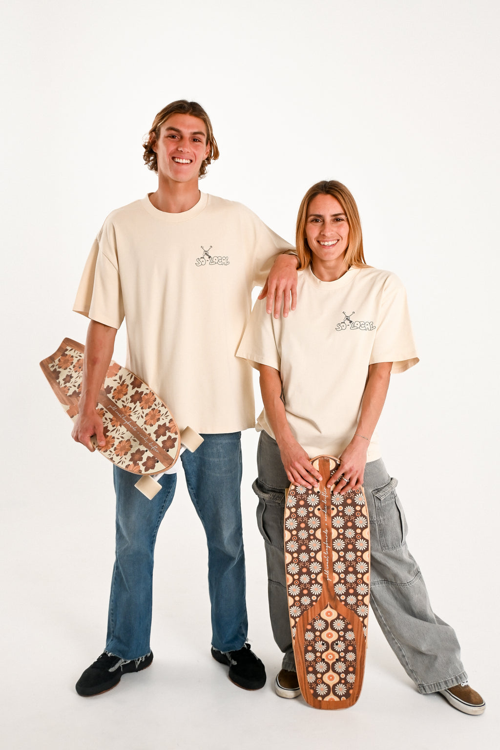 Male and female models wearing MIAMI ICE heavy faded t-shirt in butter, surf and skate streetwear, studio shot, Gold Coast Australia 