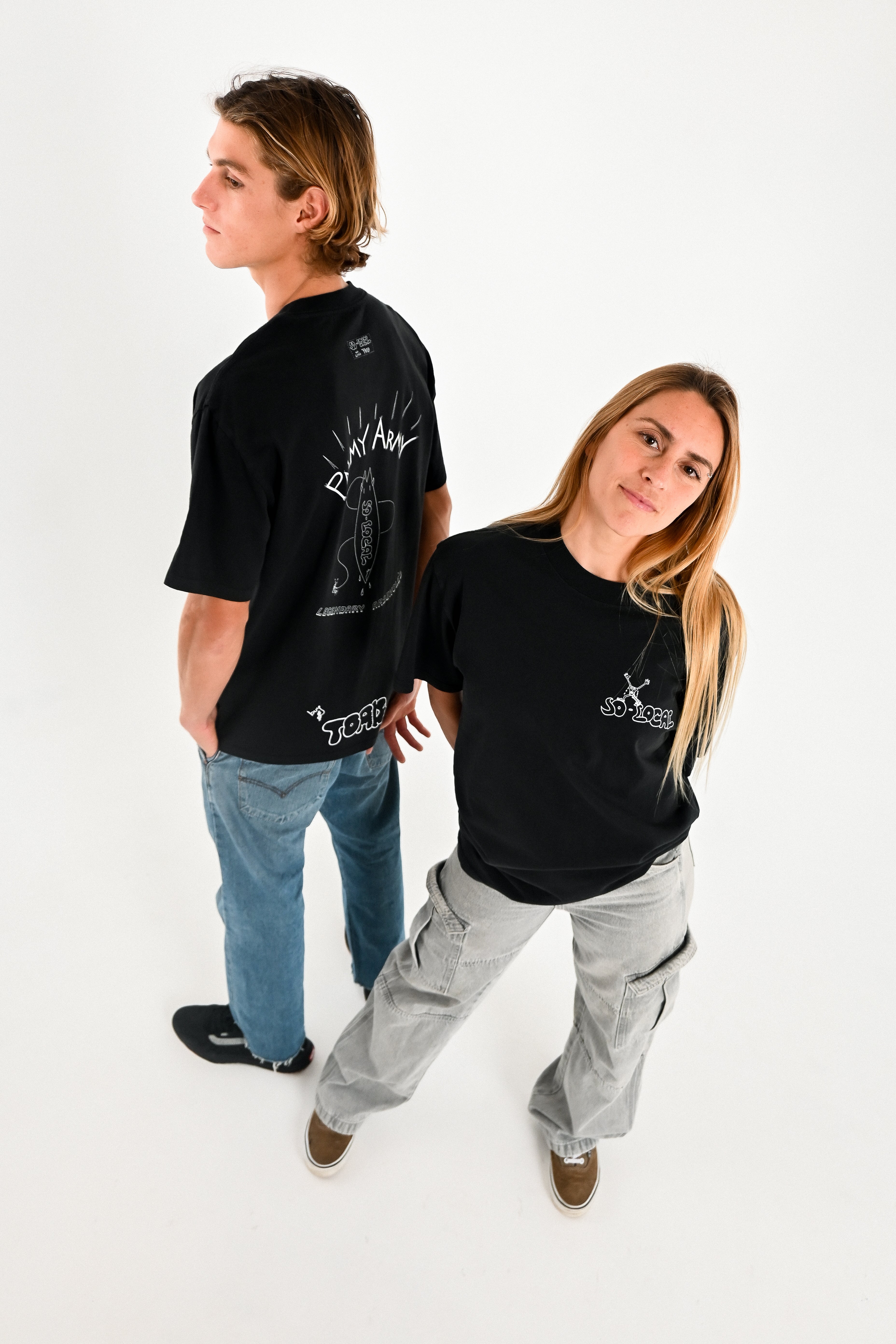 Male and female models wearing PALMY ARMY heavy faded t-shirt in black, surf and skate streetwear, studio shot, Gold Coast Australia 