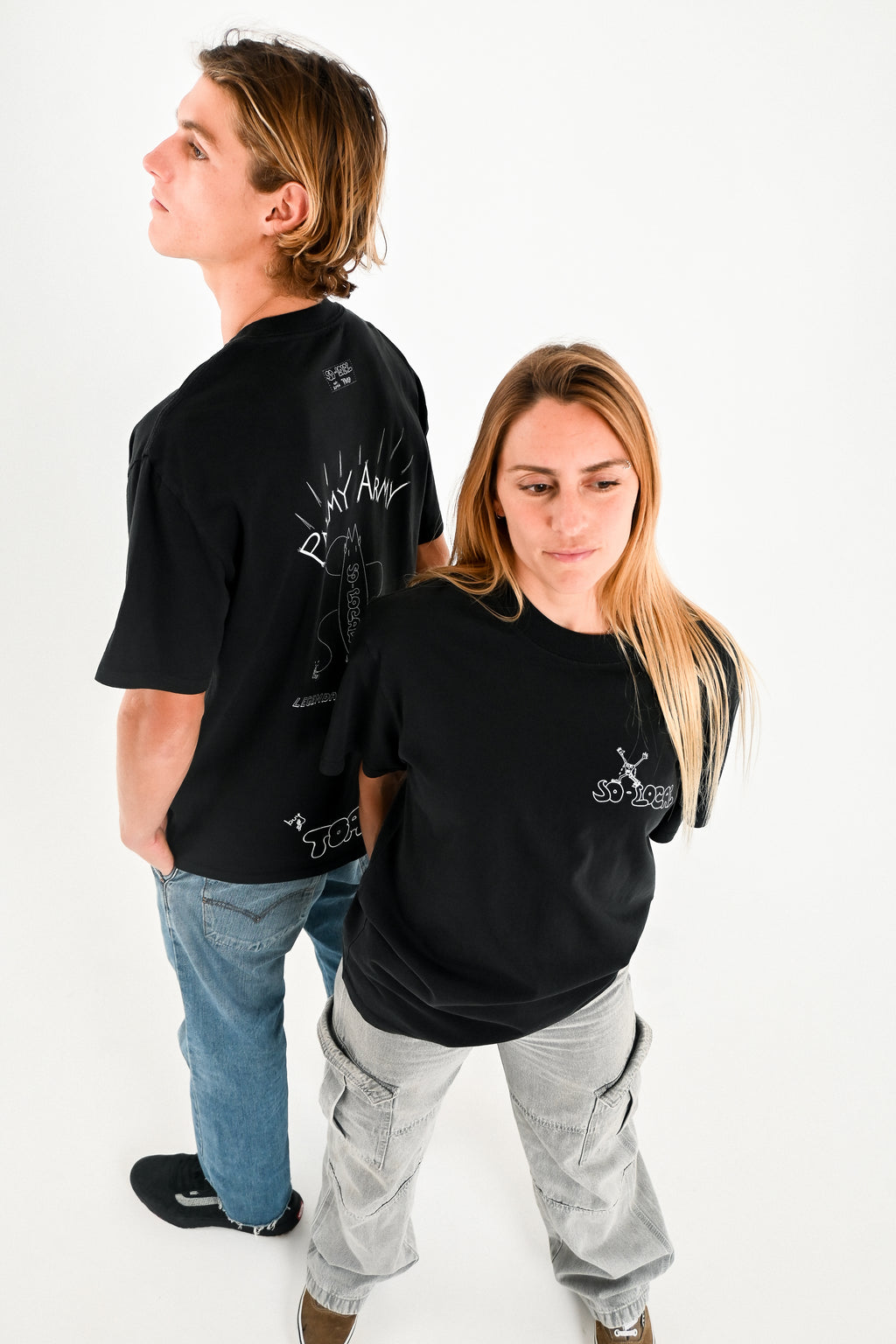 Male and female models wearing PALMY ARMY heavy faded t-shirt in black, surf and skate streetwear, studio shot, Gold Coast Australia 