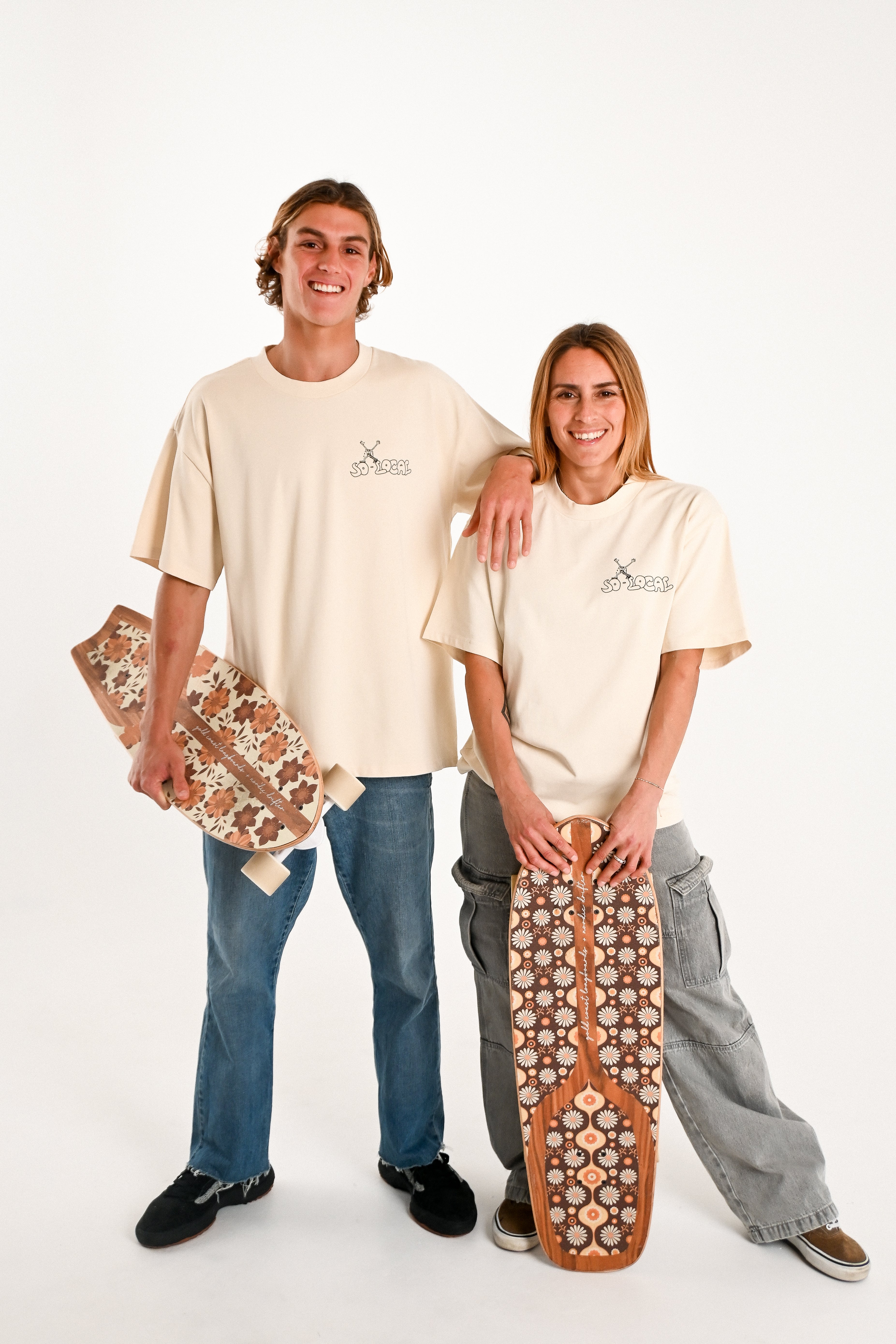 Male and female models wearing PALMY ARMY heavy faded t-shirt in butter, surf and skate streetwear, studio shot, Gold Coast Australia 