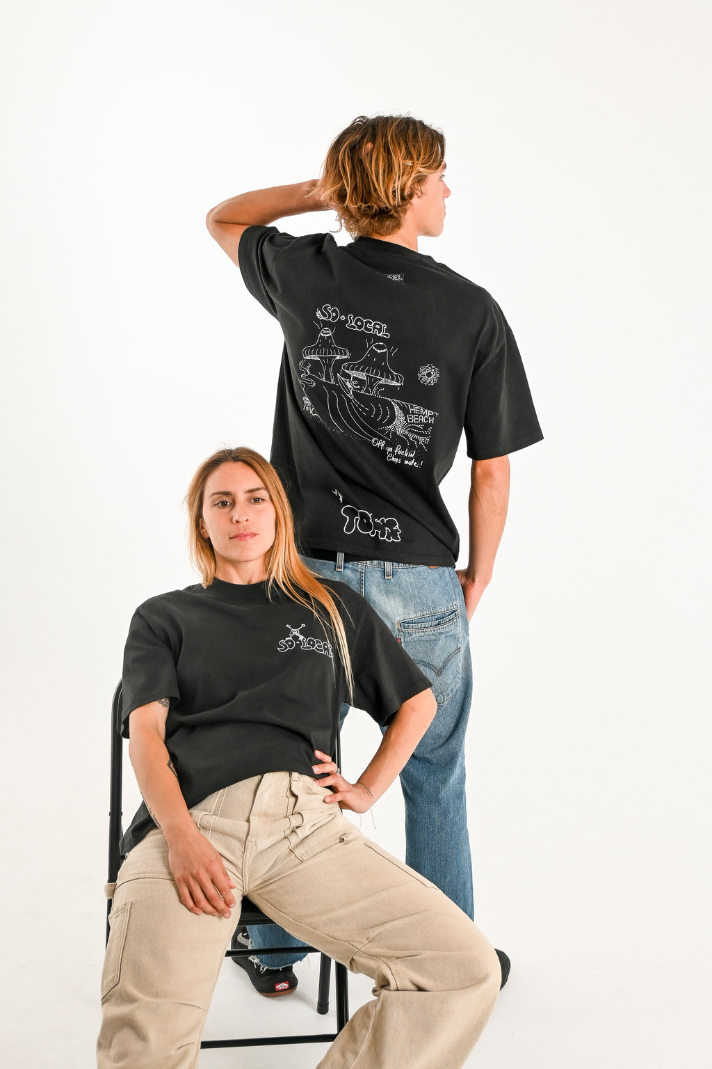 Male and female models wearing OFF YA F*CKIN CHOPS MATE (Hemp Beach) heavy faded t-shirt in black, surf and skate streetwear, studio shot, Gold Coast Australia 