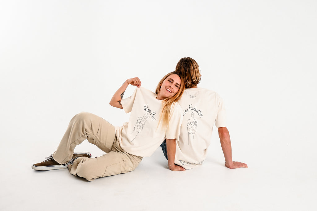 Male and female models wearing PEACE BRO heavy faded t-shirt in butter, surf and skate streetwear, studio shot, Gold Coast Australia 