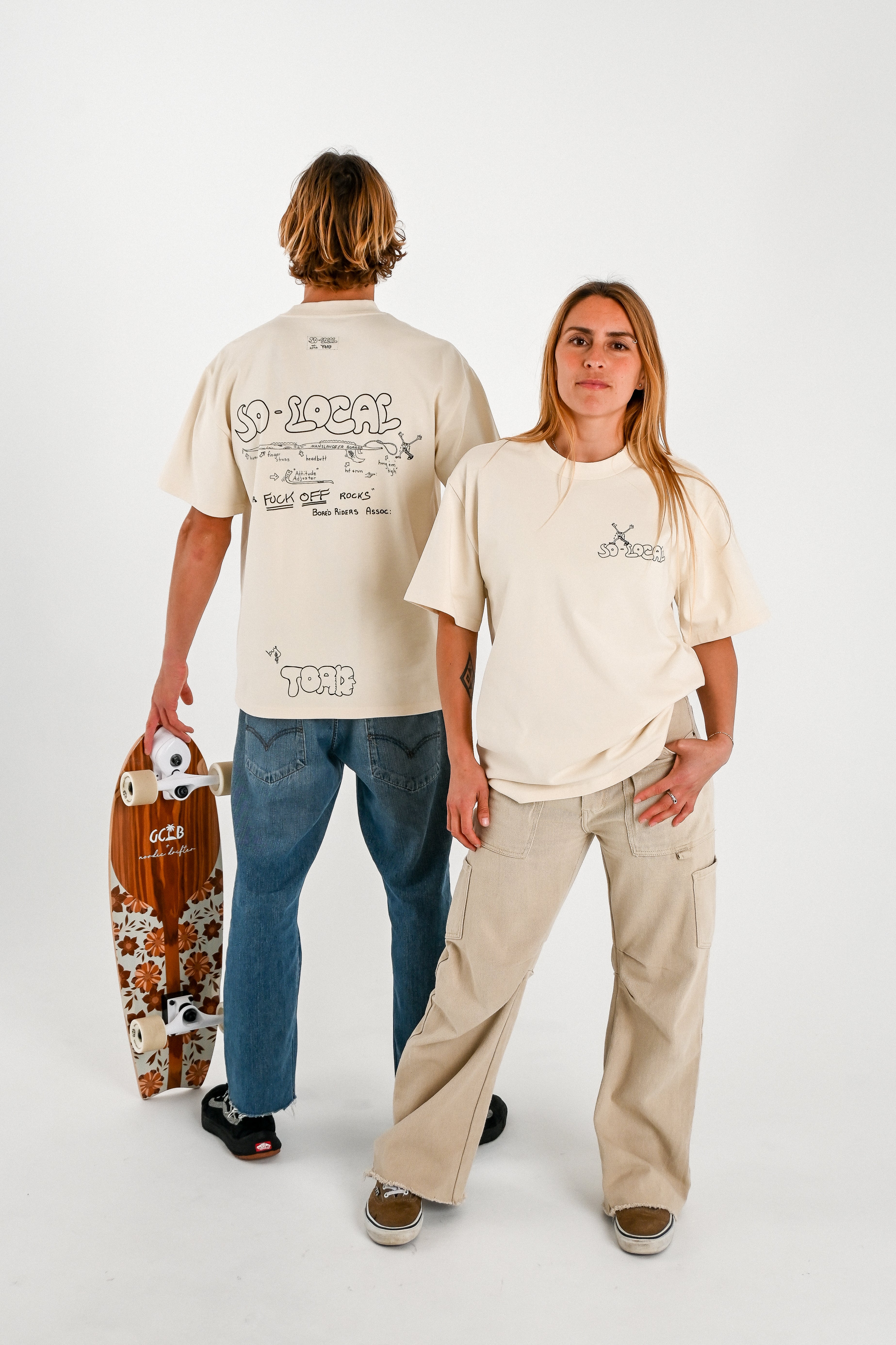 Male and female models wearing SNAPPER F*CK OFF ROCKS heavy faded t-shirt in butter, surf and skate streetwear, studio shot, Gold Coast Australia  