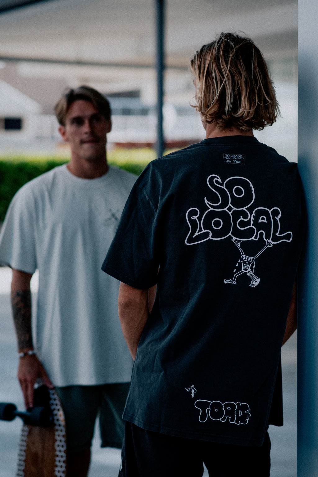Males models wearing SO LOCAL heavy faded t-shirt in butter, surf and skate streetwear, lifestyle photo, Gold Coast Australia 