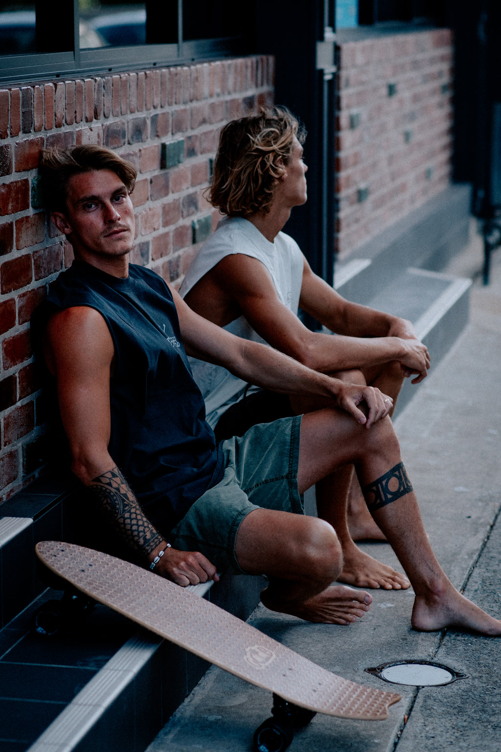 Males models wearing SO LOCAL / TANK TEE heavy faded t-shirt in black and white, surf and skate streetwear, lifestyle photo, Gold Coast Australia 