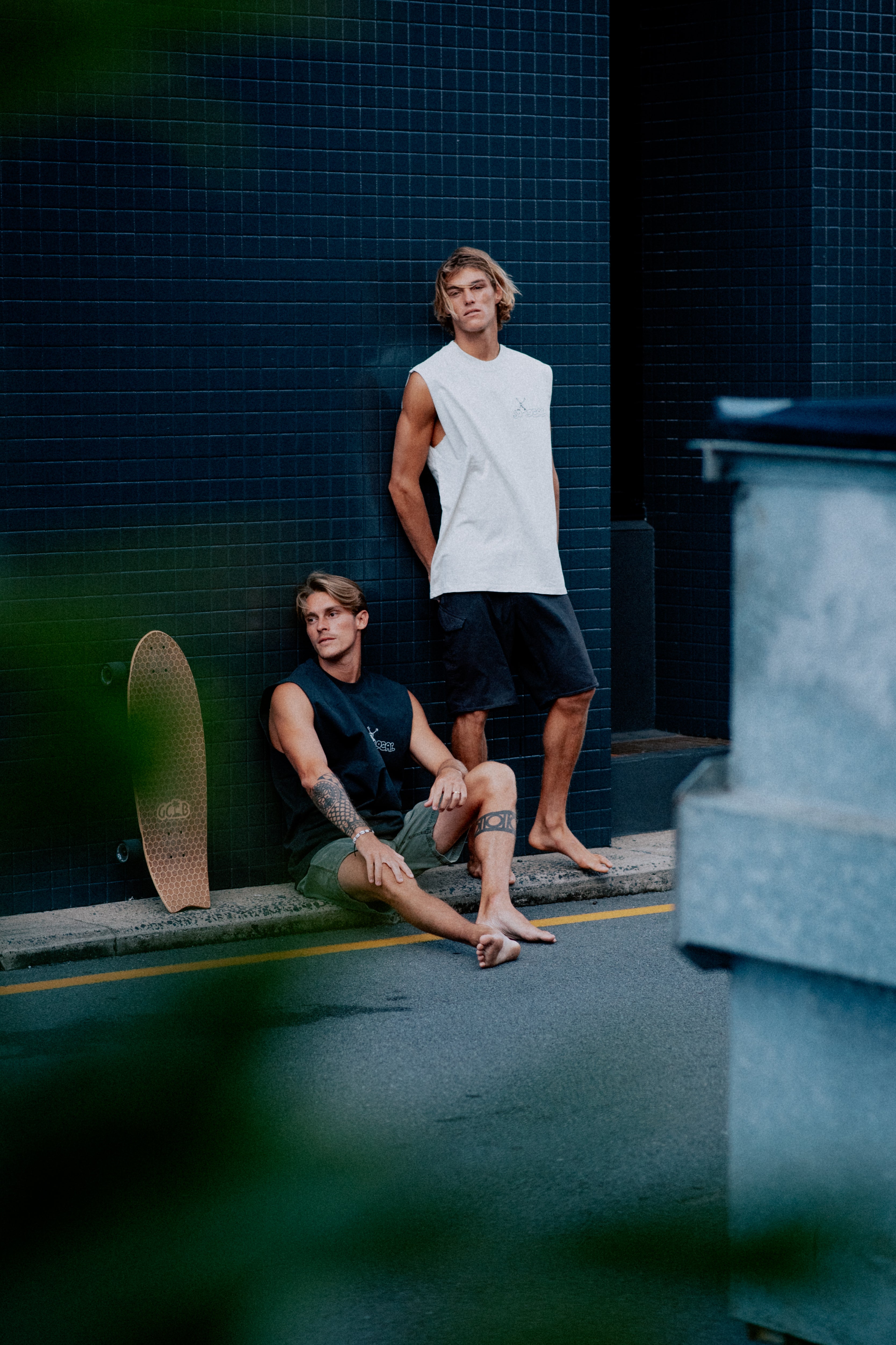 Males models wearing SO LOCAL / TANK TEE heavy faded t-shirt in black and white, surf and skate streetwear, lifestyle photo, Gold Coast Australia 