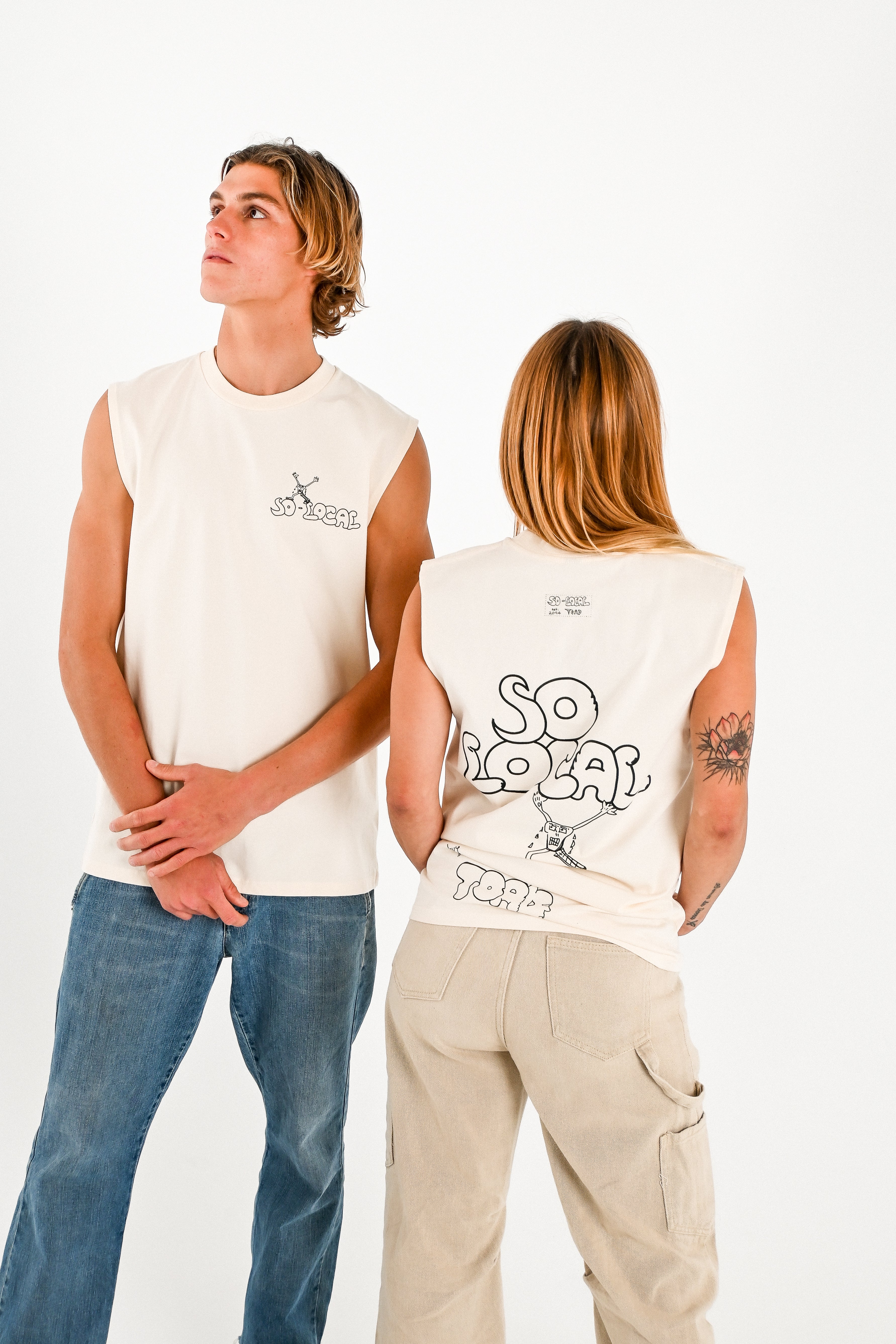 Male and female models wearing SO LOCAL / TANK TEE heavy faded t-shirt in butter, surf and skate streetwear, studio shot, Gold Coast Australia 