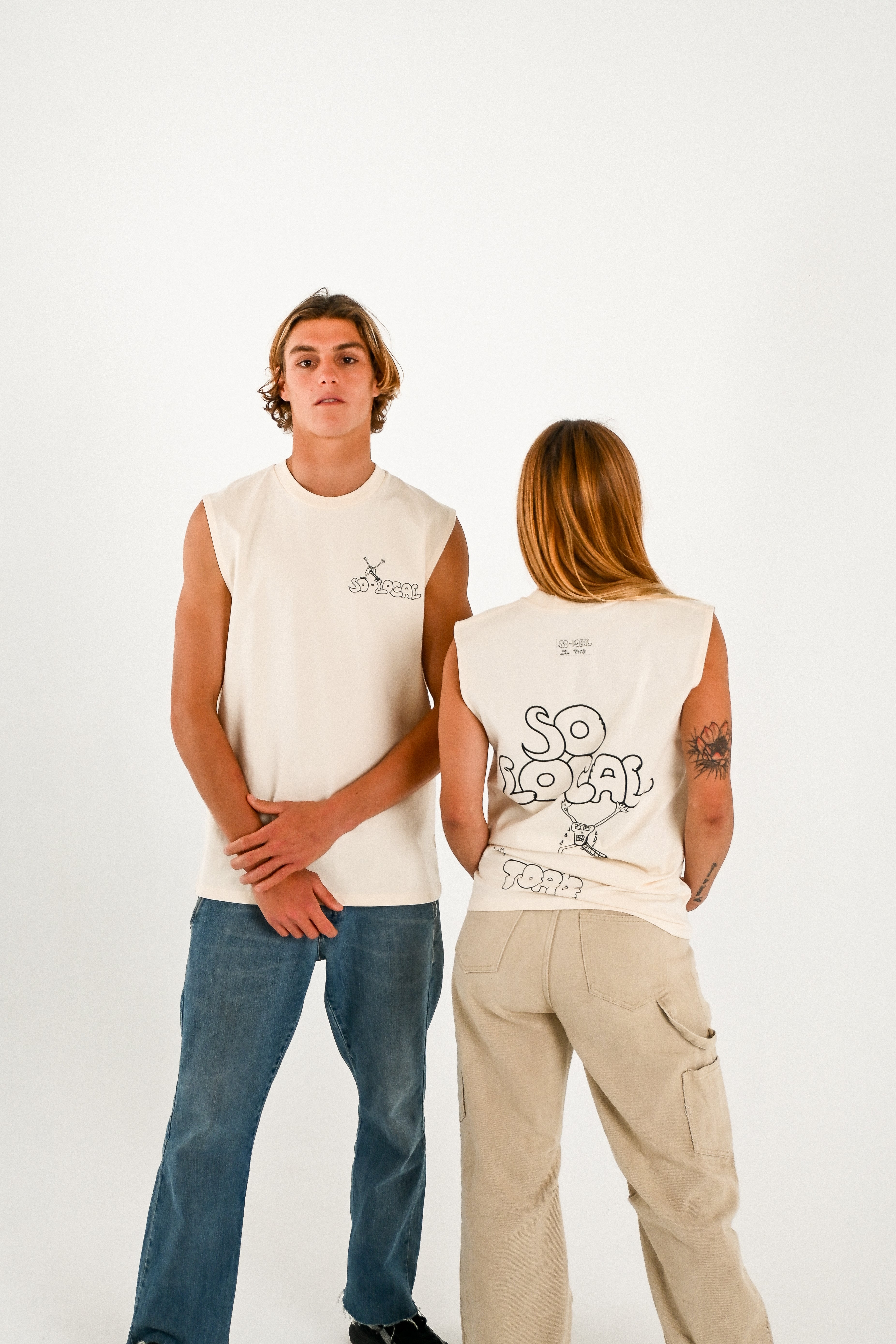 Male and female models wearing SO LOCAL / TANK TEE heavy faded t-shirt in butter, surf and skate streetwear, studio shot, Gold Coast Australia 
