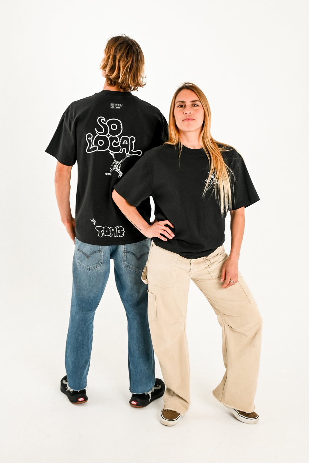 Male and female models wearing SO LOCAL heavy faded t-shirt in black, surf and skate streetwear, studio shot, Gold Coast Australia 