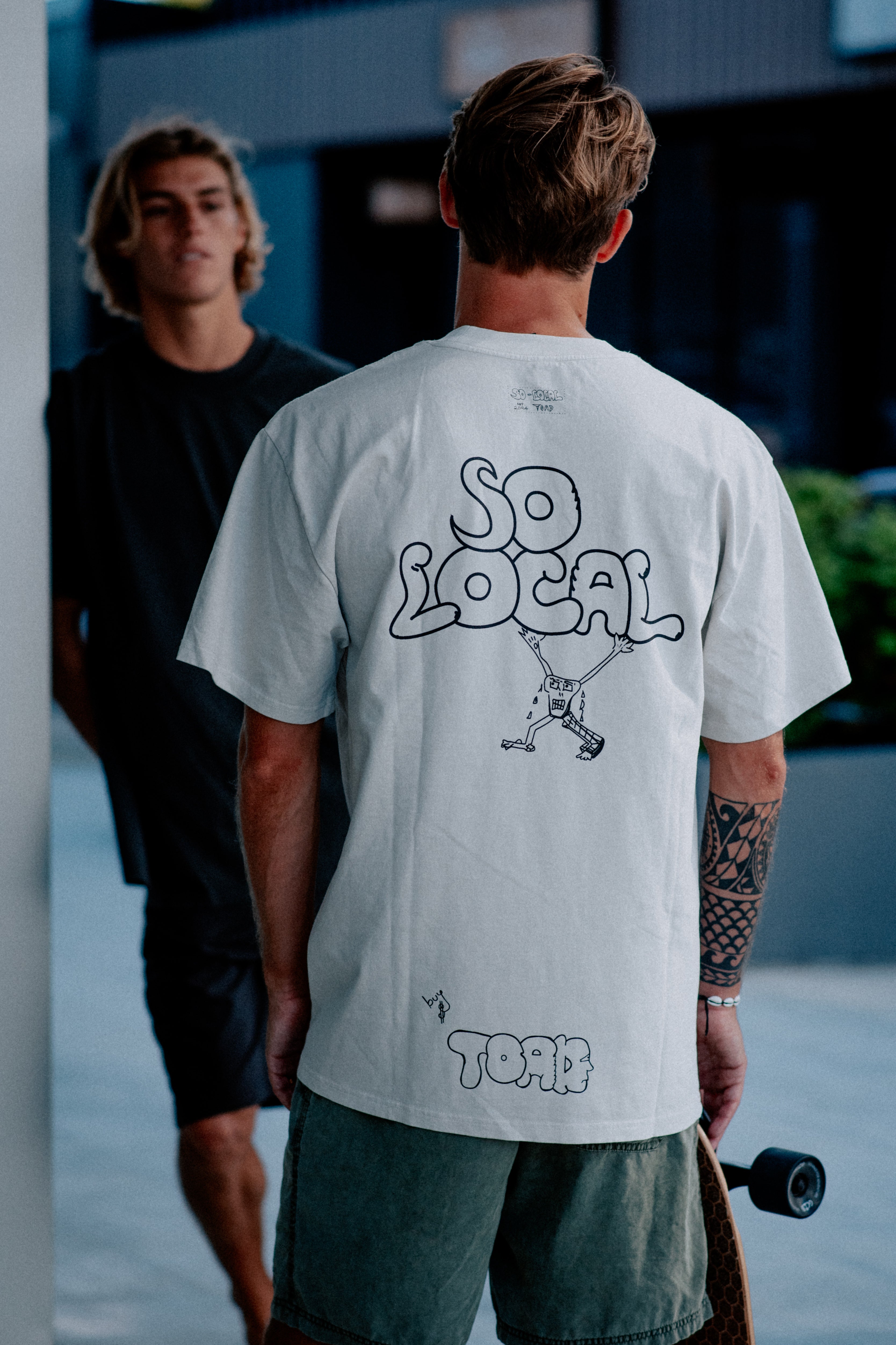 Males models wearing SO LOCAL heavy faded t-shirt in black and white, surf and skate streetwear, lifestyle photo, Gold Coast Australia 