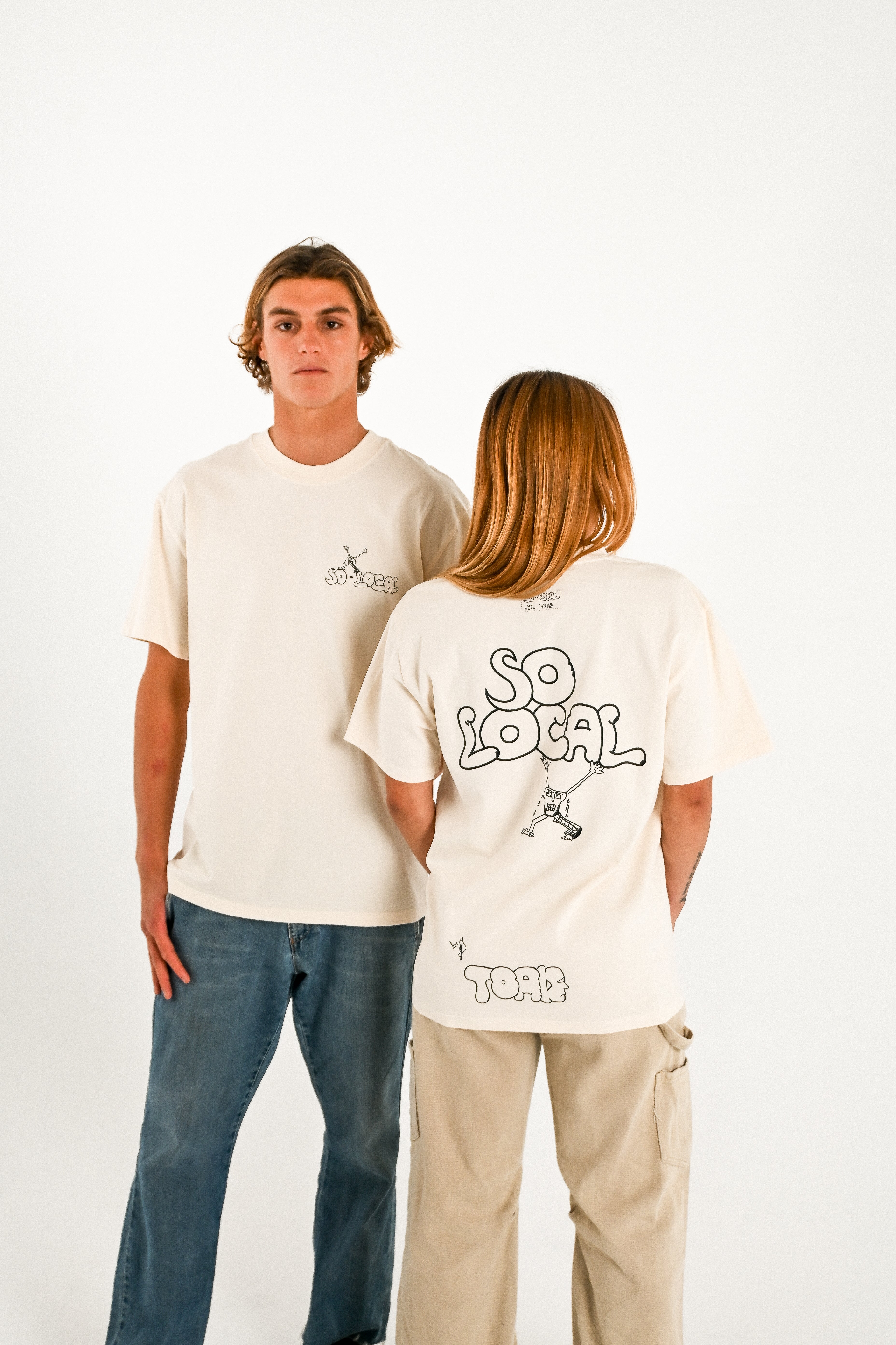Male and female models wearing SO LOCAL heavy faded t-shirt in butter, surf and skate streetwear, studio shot, Gold Coast Australia 