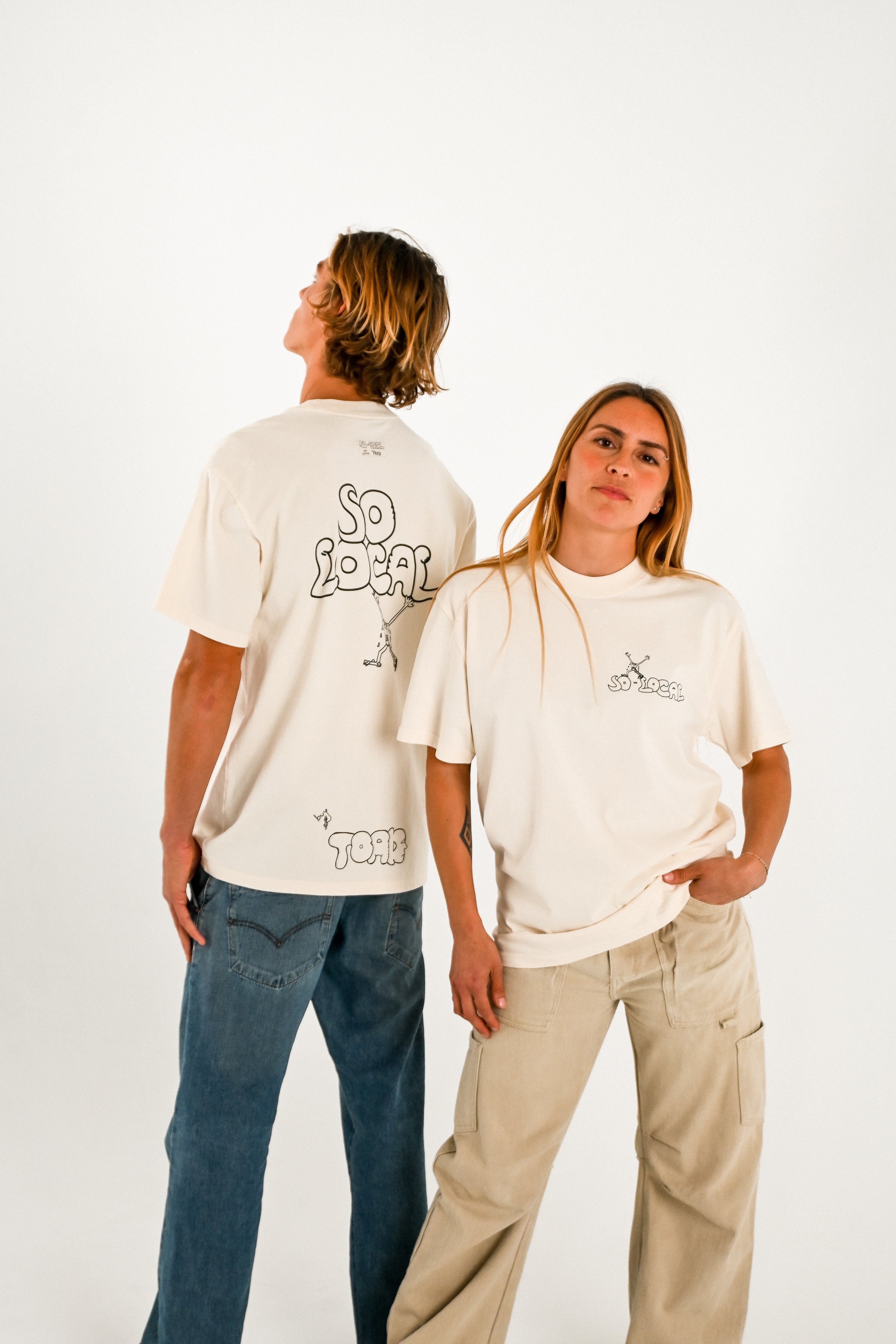Male and female models wearing SO LOCAL heavy faded t-shirt in butter, surf and skate streetwear, studio shot, Gold Coast Australia 