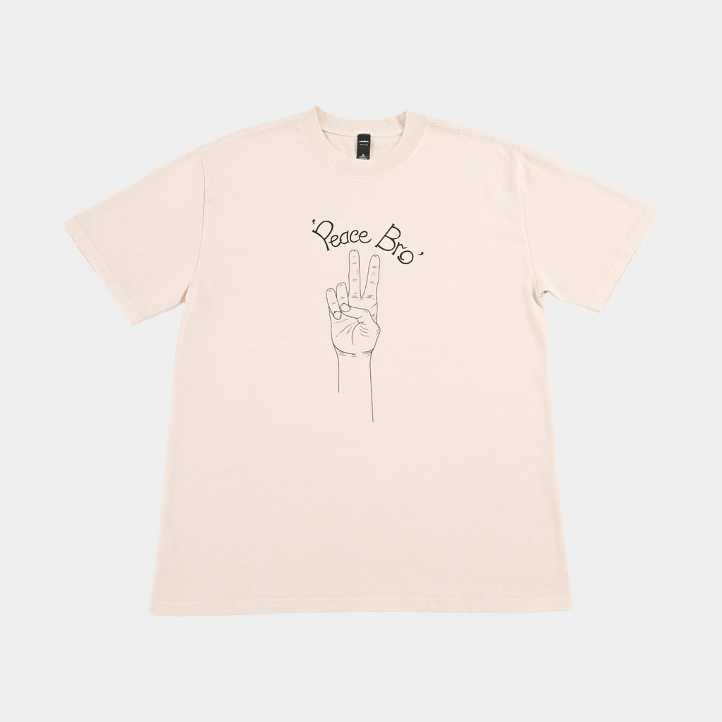 Front flatlay of PEACE BRO heavy faded t-shirt in butter, surf and skate streetwear, Gold Coast Australia  