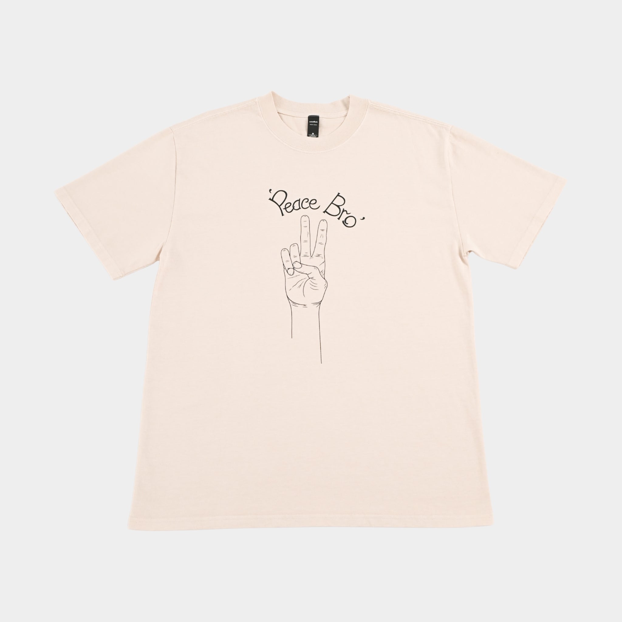 Front flatlay of PEACE BRO heavy faded t-shirt in butter, surf and skate streetwear, Gold Coast Australia  